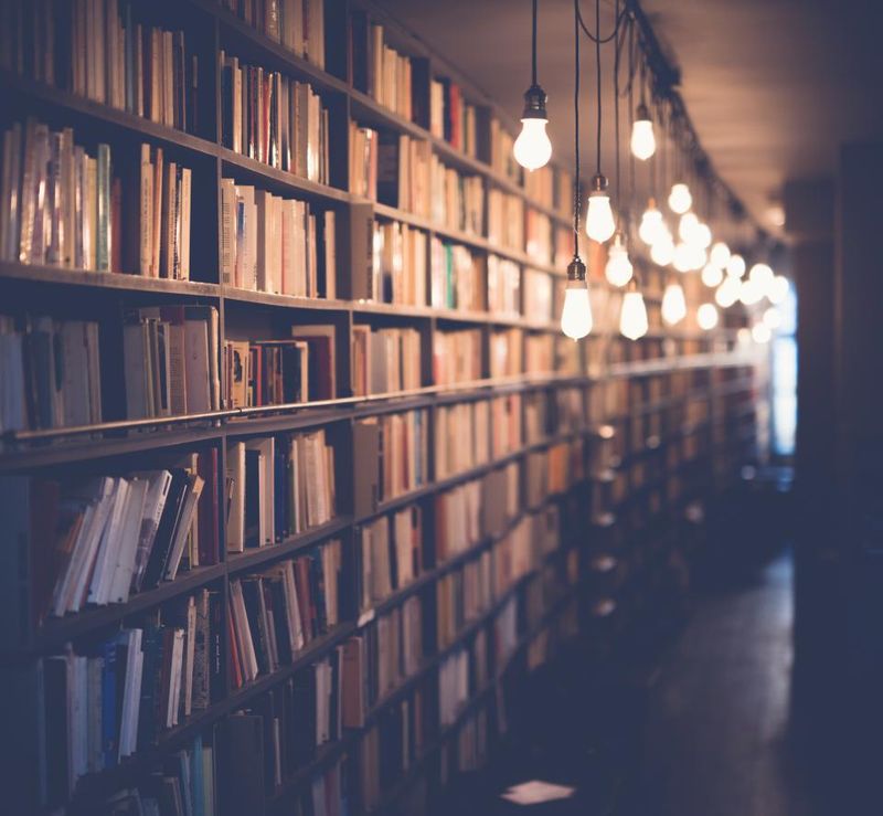 A long library aisle lined with books